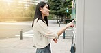 Asian woman, vending machine or city with choice for selection, pick or snack on sidewalk. Japan, female person or local shopper with self service station, vendor or shop dispenser for option in town