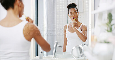 Buy stock photo Woman, mirror and cleaning mouth in home, oral hygiene practice and morning routine in bathroom. Female person, reflection and treatment to prevent plaque or cavity, fresh breath and dental health