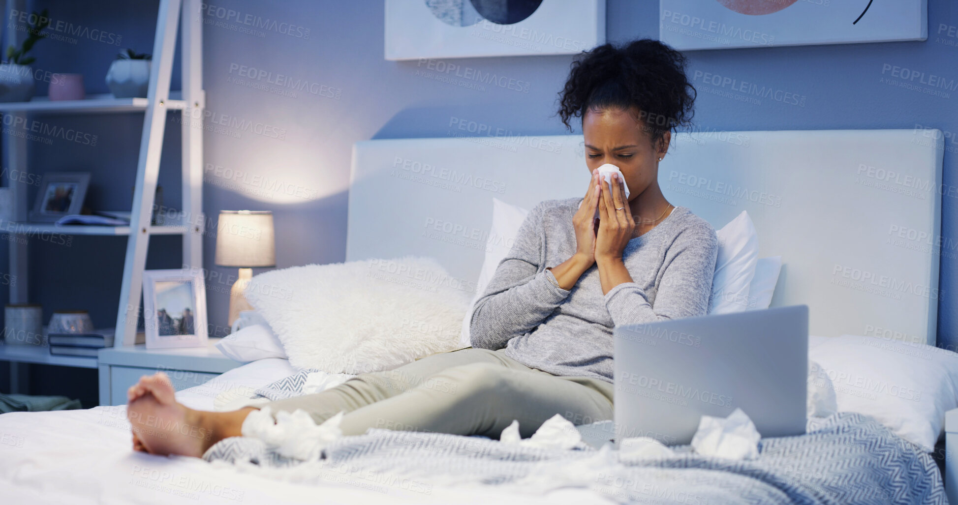 Buy stock photo Laptop, bed and woman blowing nose with remote work, research or telehealth with freelance business. Tissue, night and sick person in bedroom with cold, flu and computer for online project at home.