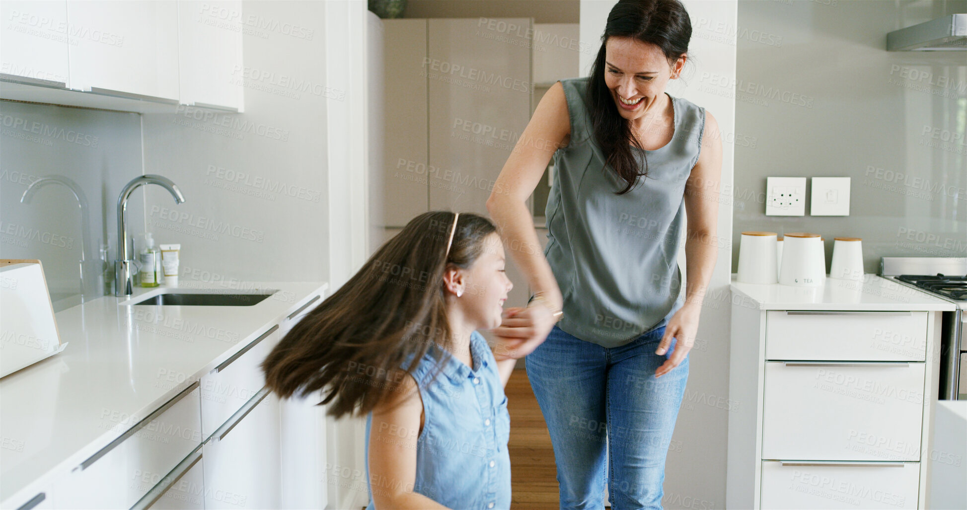 Buy stock photo Mother, daughter and happy with dancing in kitchen for celebration, bonding and teaching steps. Energy, woman dancer and girl kid in home with moving together for weekend entertainment and spinning