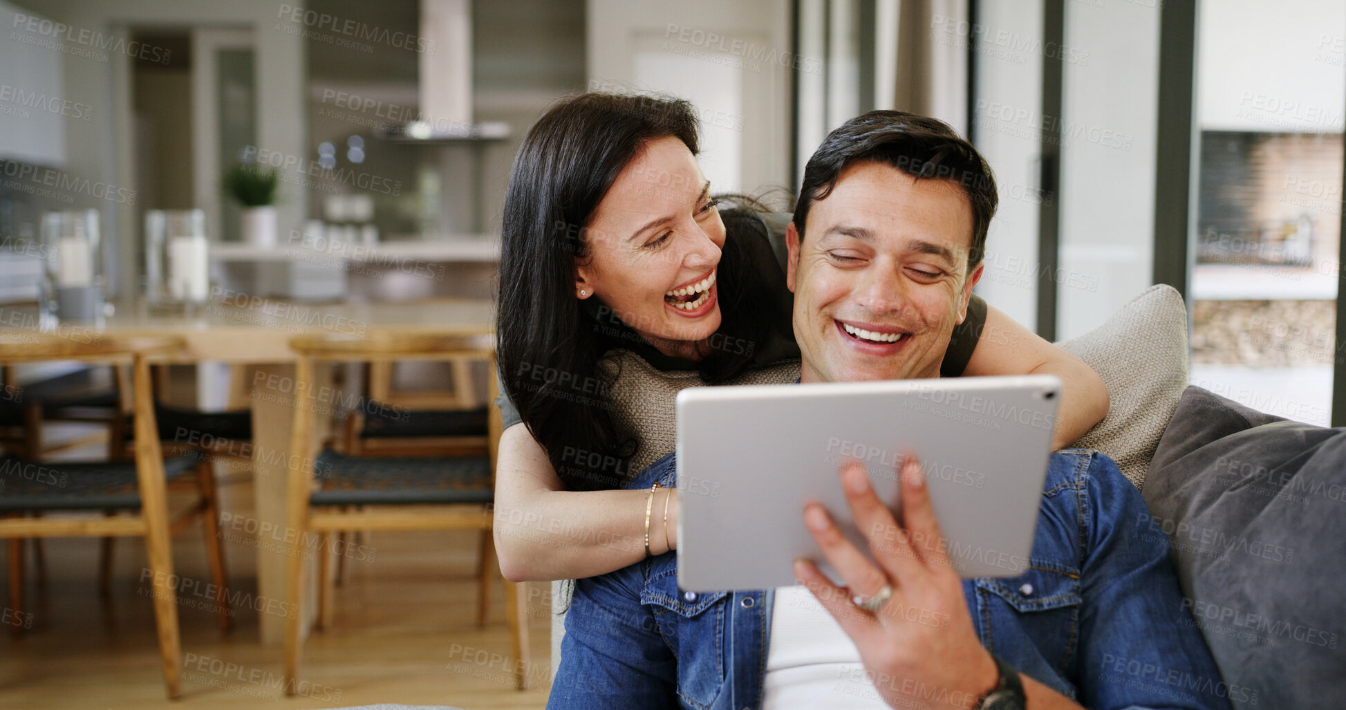Buy stock photo Home, sofa and couple with tablet for laughing, streaming service and watch movie for entertainment. House, man and woman with digital for website subscription, video opinion and bonding with joke