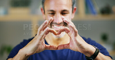 Buy stock photo Happy man, sign and heart hands with love for trust, support or commitment and care at home. Closeup, male person or smile with symbol, emoji or romantic gesture for expression, emotion or feeling