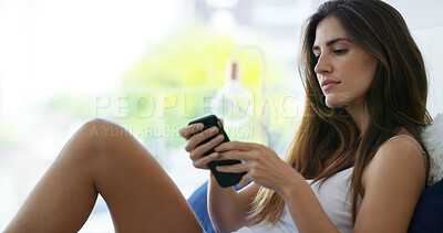 Buy stock photo Morning, phone and relax with woman in bedroom of home for communication, social media or text message. Mobile, reading or typing with serious person in apartment to update dating app profile