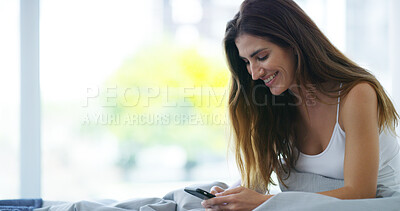 Buy stock photo Morning, bedroom and woman with smartphone for chat, social media and online contact with smile. Home, female person and happy with mobile for application, dating website and text message in house