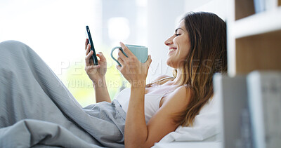 Buy stock photo Woman, coffee and happy with phone in bed for reading morning news, online notifications or mobile chat. Relax, person and smartphone in bedroom for social media scroll, streaming service or caffeine