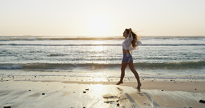 Buy stock photo Beach, sunset and travel with woman, vacation and waves with weekend break, carefree and calm. Happy person, outdoor and seaside with girl, summer holiday and adventure with journey, energy or nature