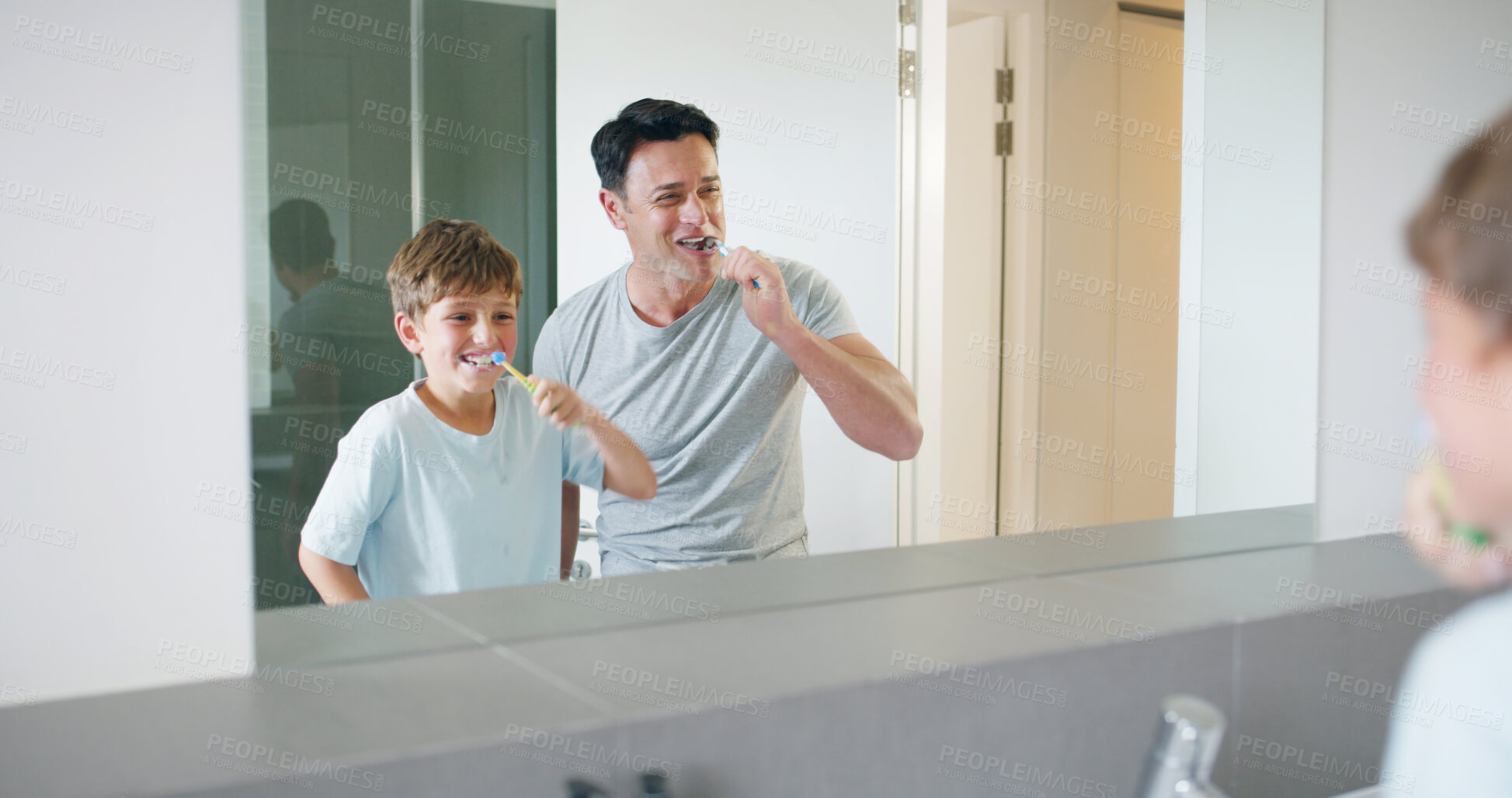 Buy stock photo Mirror, dental care and father brushing teeth with child in bathroom for preventing gum disease. Bonding, oral health and dad teaching boy kid mouth routine in morning for fresh breath in home.