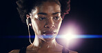 Earphones, fitness and black woman at night for training, exercise and intense workout. Sports, lens flare and face of person sweating for wellness, health and listening to music on dark background