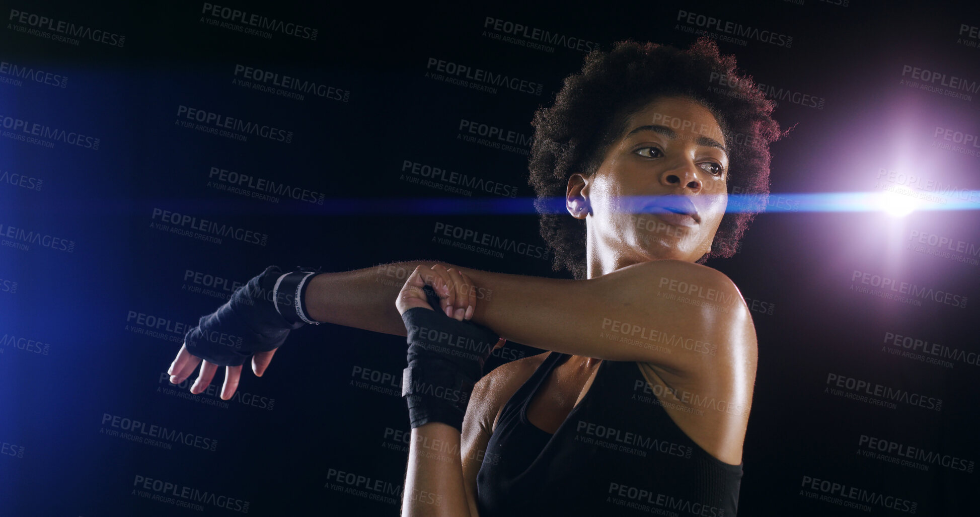 Buy stock photo Woman, stretching arms and martial arts in studio with workout, exercise and combat sport by black background. African person, athlete and warm up with muscle for fight, training and competition