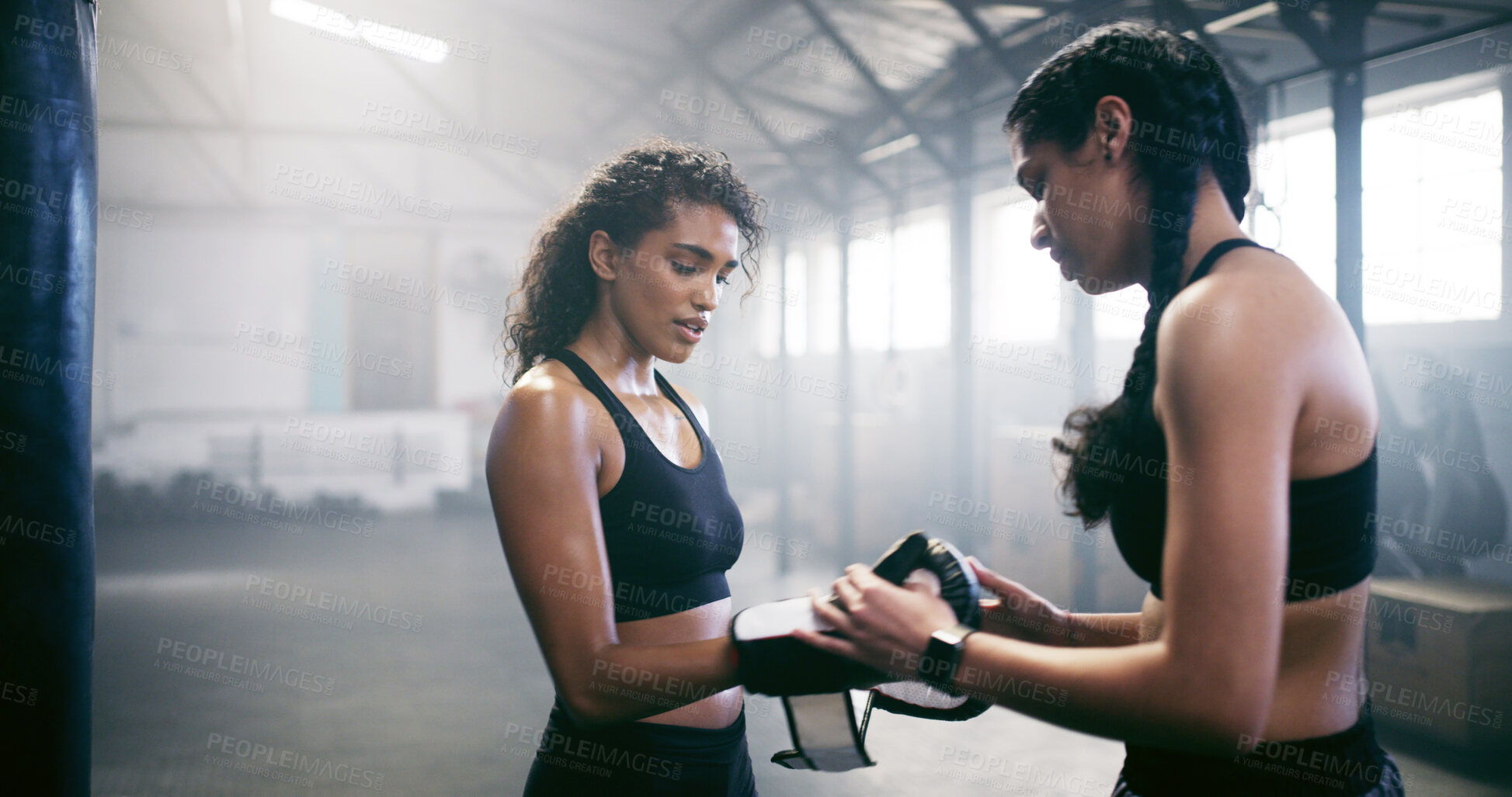 Buy stock photo Women, help or boxer with coach or gloves for self defense, fighting and fitness workout in gym. Start, people or fighter with fist wraps on hands for boxing safety, training exercise or protection