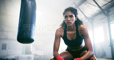 Buy stock photo Fitness, tired boxer and woman in gym for intense workout, fatigue and exercise recovery on break. Boxing, resting and athlete relax in sports club for thinking, sweating or breathing for body health