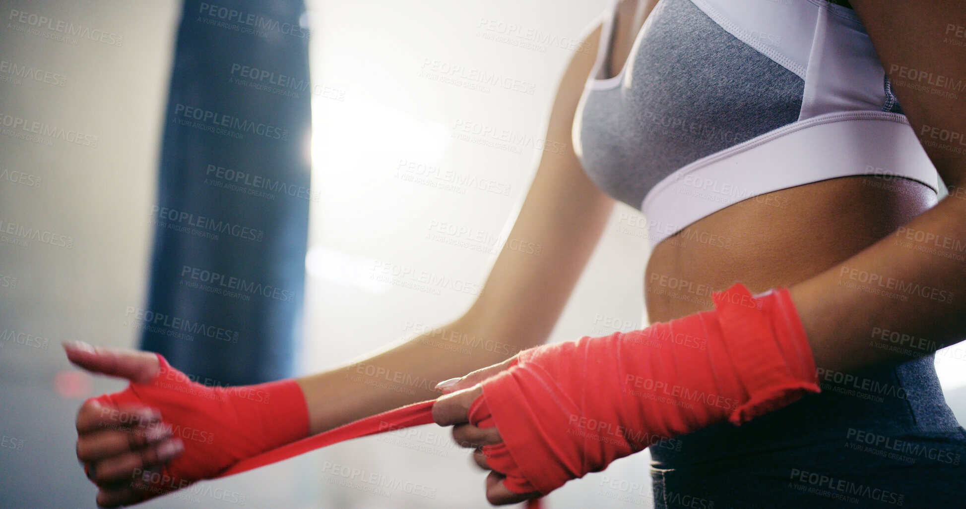 Buy stock photo Woman, hands and boxer wrapping fist with bandage for self defense, fighting and workout in gym. Fitness, start or girl fighter with strap on hands for boxing safety, sports and gloves protection