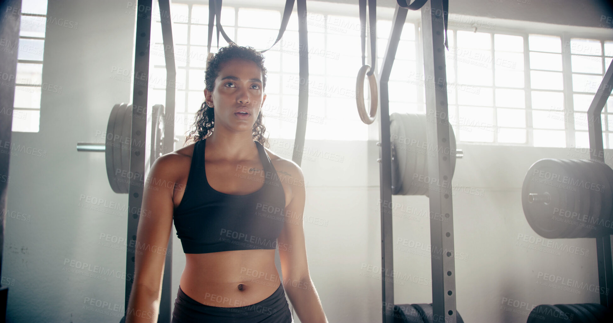 Buy stock photo Fitness, woman and thinking in gym with rest, catching breath or training at weightlifting equipment. Female athlete, sweat or break in sports center with commitment, mindset or ready for exercise