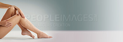 Buy stock photo Woman, legs and epilation at mockup space for skincare, relax and skin hydration in banner. Person, dermatology and feet on studio background for spa treatment, hair removal and refreshing cleanse