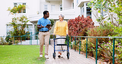 Buy stock photo Caregiver, outdoor and tablet with old woman and walker for rehabilitation, healthcare report or support plan. Medical, advice and nurse with person with a disability in nursing home for elderly care