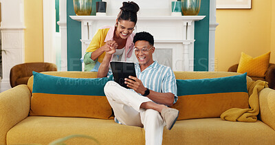 Buy stock photo Celebration, holding hands and tablet with couple on sofa in living room of home for bonus or victory. Achievement, motivation or success with man and woman cheering good news of new job together