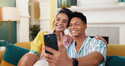 Buy stock photo Selfie, couple and bonding in living room, smile and profile picture for memory in home, love and hug. Photography, man and embrace with woman in lounge, online and moment for romance and peace sign