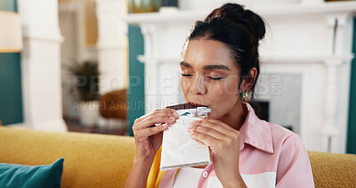 Buy stock photo Woman, chocolate peace and relax in home, comfort food and craving cacao nutrition in living room. Female person, eyes closed and sweet sugar snack to enjoy, dessert and bite of dark gourmet candy