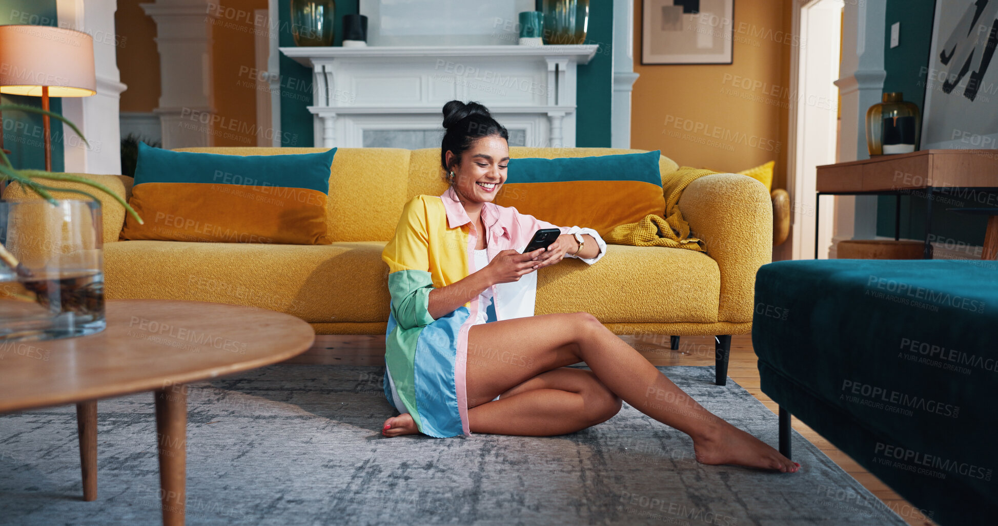 Buy stock photo Phone, relax and smile with woman on living room floor in home for communication or social media. App, text message and time off with happy person in apartment for chatting on weekend morning