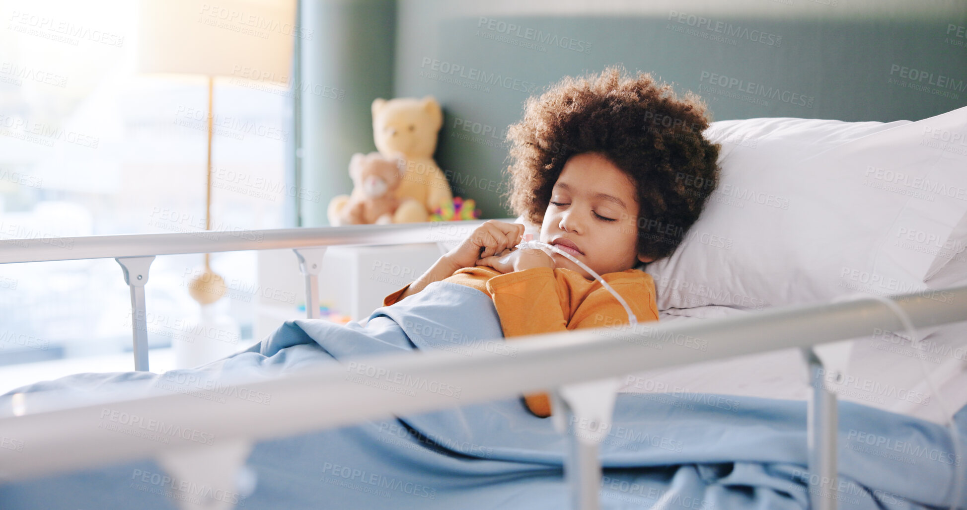Buy stock photo Hospital, sleeping and child in bed with IV drip for medication, medicine and treatment for rehabilitation. Healthcare, pediatric and tired boy with fatigue for medical service, diagnosis or recovery