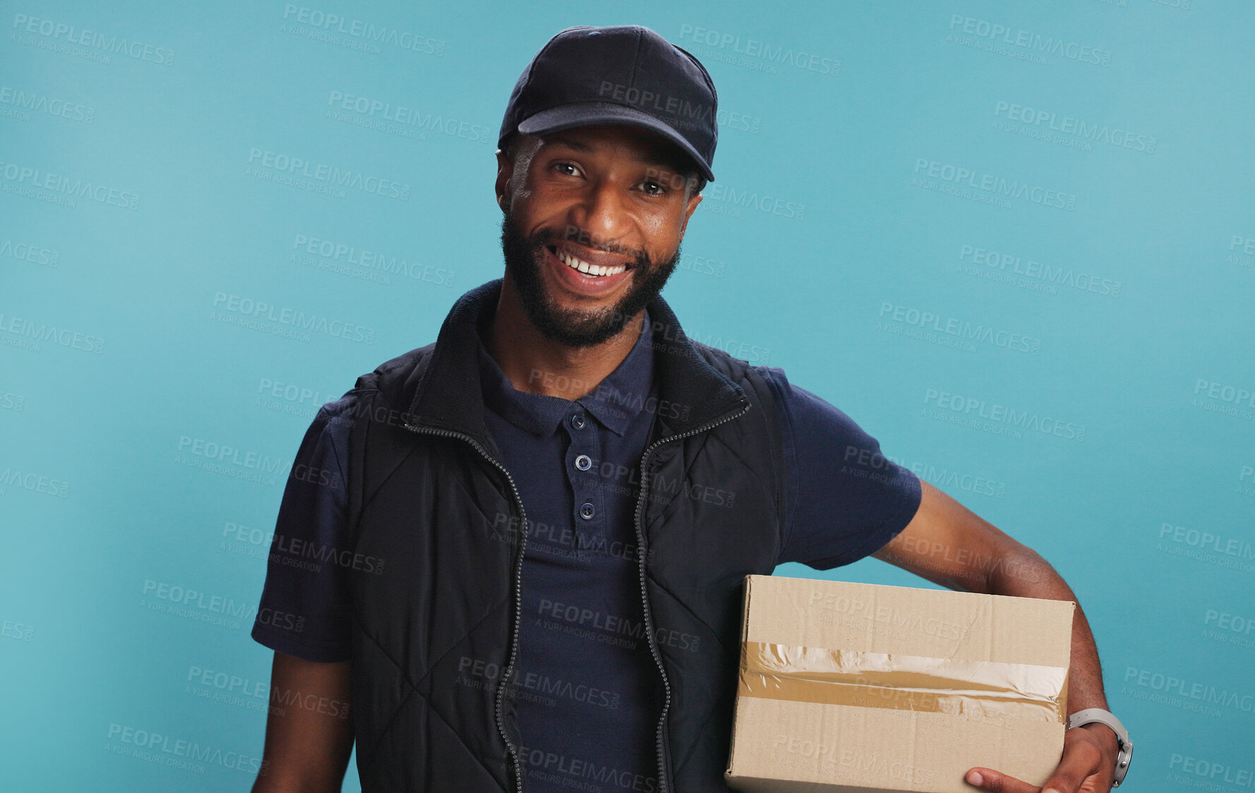 Buy stock photo Portrait, courier and happy black man with box in studio for ecommerce, logistics and supply chain. Face, delivery guy and package for distribution, shipping and online shopping on blue background