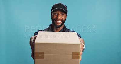 Buy stock photo Portrait, delivery man and offer box for shipping, logistics or supply chain. African courier, face and giving package for distribution service, ecommerce or smile for order on blue studio background
