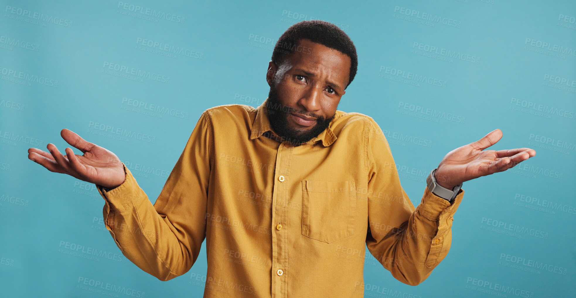 Buy stock photo Portrait, confused black man and shrug in studio for choice, decision or option comparison on blue background. Face, doubt and puzzled person with palm gesture for question, why and dont know emoji