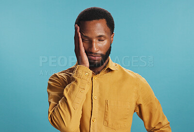 Buy stock photo Stress, tired and black man with headache in studio, tension or pressure on blue background. African person, burnout or model with migraine, illness or frustrated with brain fog, pain and fatigue