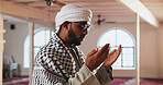 Religion, Muslim and man in Mosque for prayer, worship and faith in religious building. Spiritual, Allah and person with hands for Ramadan Kareem, praying and Islamic belief in Saudi Arabia temple