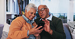 House, cellphone and senior couple on couch, love and message to contact, texting and social media. Happy, apartment and old man with elderly woman on sofa, communication and smartphone in lounge