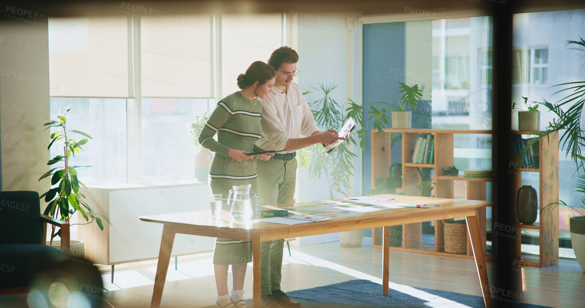 Buy stock photo Collaboration, design and tablet with editor team in creative workplace for discussion or planning. Conversation, decision or magazine with business man and woman in office boardroom for publishing