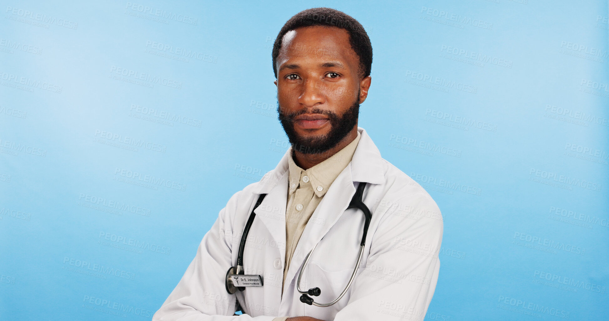 Buy stock photo Portrait, doctor and black man with arms crossed, healthcare and employee on blue studio background. African person, face and medical with professional, pride and confidence with lab coat or surgeon