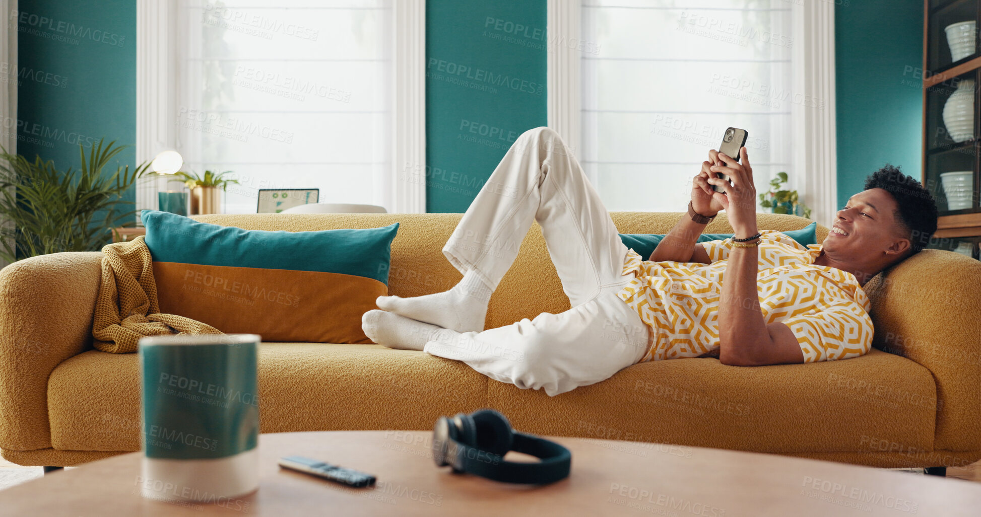 Buy stock photo Smile, man and relax on couch with phone at house for communication, dating website and chatting. Happy, male person and mobile for texting contact, online match and browse social media for streaming