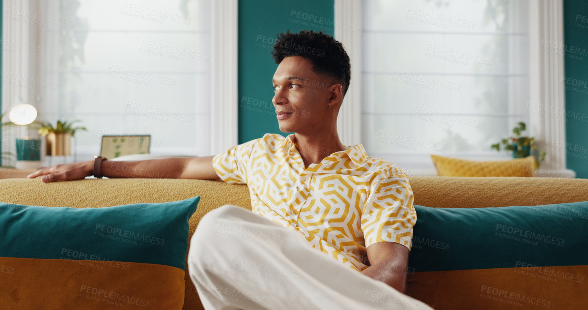 Buy stock photo Man, thinking and plan for vacation in hotel, contemplating itinerary and hospitality services. Male person, relax and problem solving schedule for time management on couch, dream and holiday suite