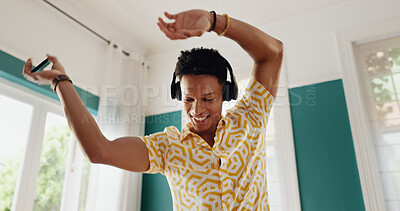 Buy stock photo Happy man, headphones and dancing with music for audio streaming, podcast or online subscription at home. Excited, male person or carefree user with smile for sound listening, freedom or playlist