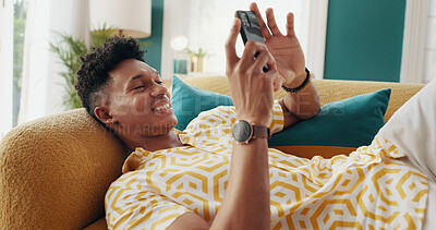 Buy stock photo Phone, relax and happy man in home, reading blog and content creator post on social media profile. Mobile, sofa and person on chat app for communication, check notification and internet forum online