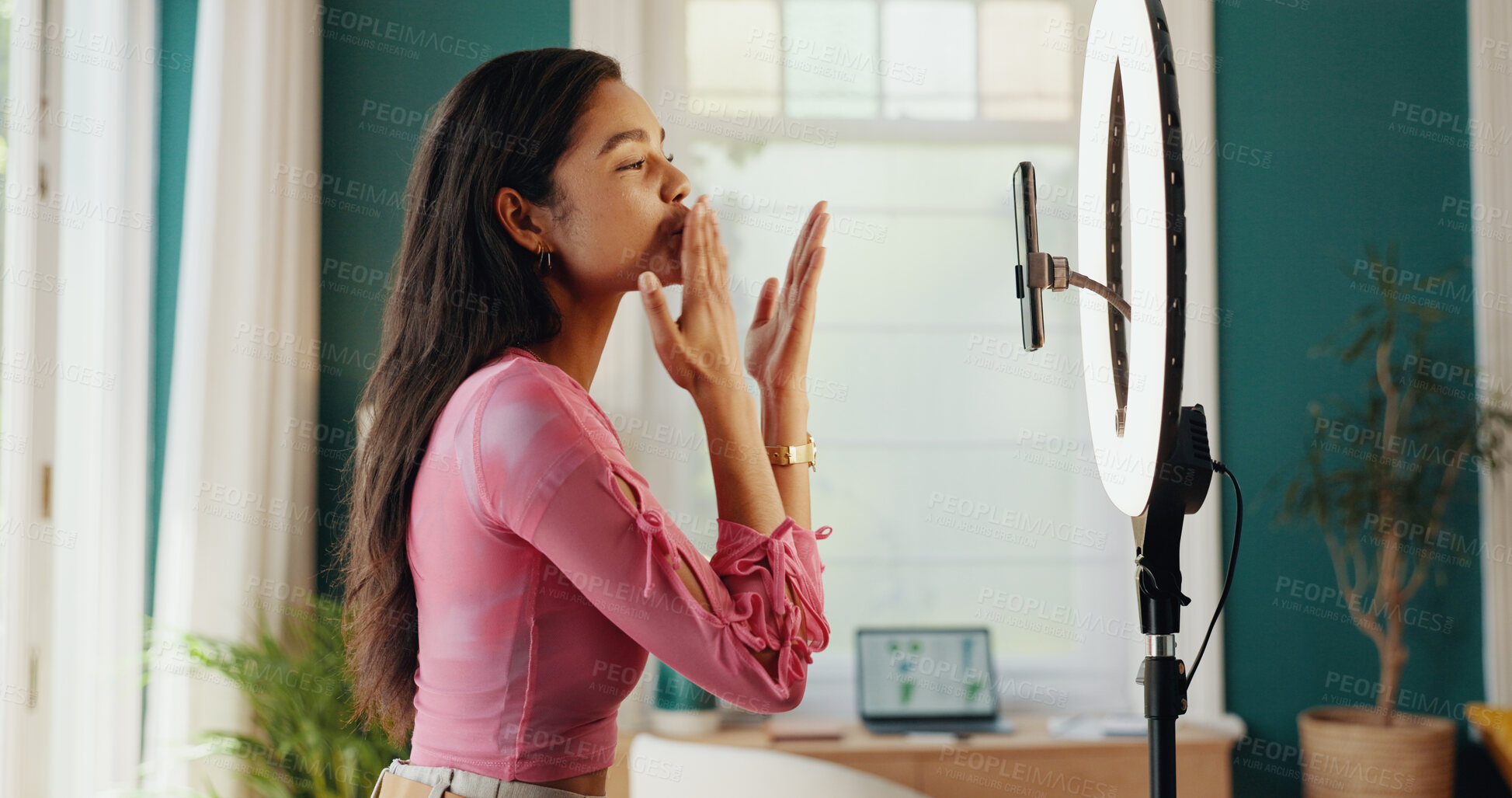 Buy stock photo Happy girl, influencer and blowing kiss with ring light for virtual entertainment, content creation or fans at home. Female person, user or vlogger with love for followers, interaction or engagement