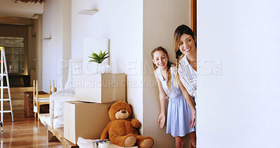 Buy stock photo Playing, mom and child in new house, hiding and happy for investment of real estate, fun and moving. Boxes, laughing and bonding with games in home, family and woman with daughter in property