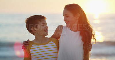 Buy stock photo Smile, children and smile with hug outdoor for sibling love, summer vacation and bonding together. Happy, kids and embracing with lens flare for getaway trip, family support and affection at ocean