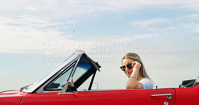 Buy stock photo Portrait, road trip and sunglasses with woman in convertible for adventure, break or travel on blue sky. Holiday, summer and vacation with person outdoor in sports car for drive, journey or transport
