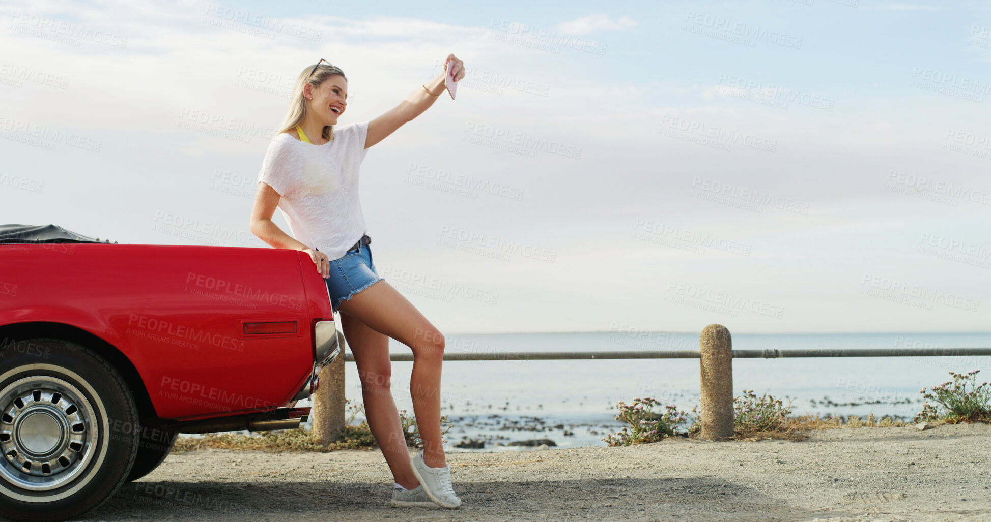 Buy stock photo Road trip, girl and selfie with car for vacation, travel and holiday outdoor by ocean. Convertible transport, woman and picture on journey for memory, social media post and excited influencer vlog