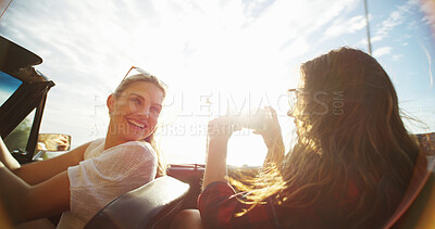 Buy stock photo Road trip, friends and women with car, phone and picture for travel and vacation or summer holiday. Convertible transport, happy girls and photography on journey for memory and social media post