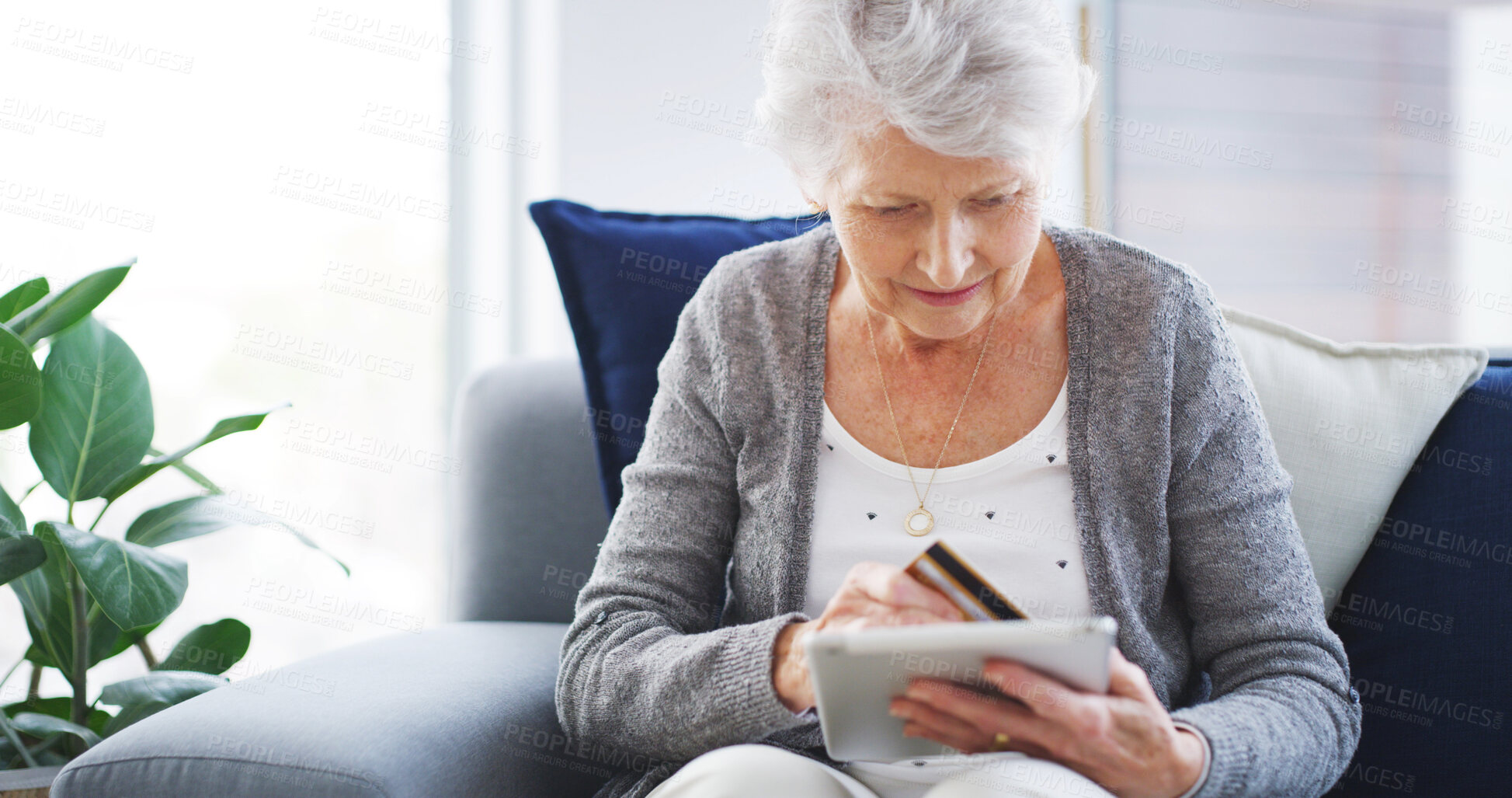 Buy stock photo Senior, woman and tablet with credit card in home for online shopping, internet banking or easy checkout on sofa. Ecommerce, old person or digital app for debit transaction or retirement plan payment