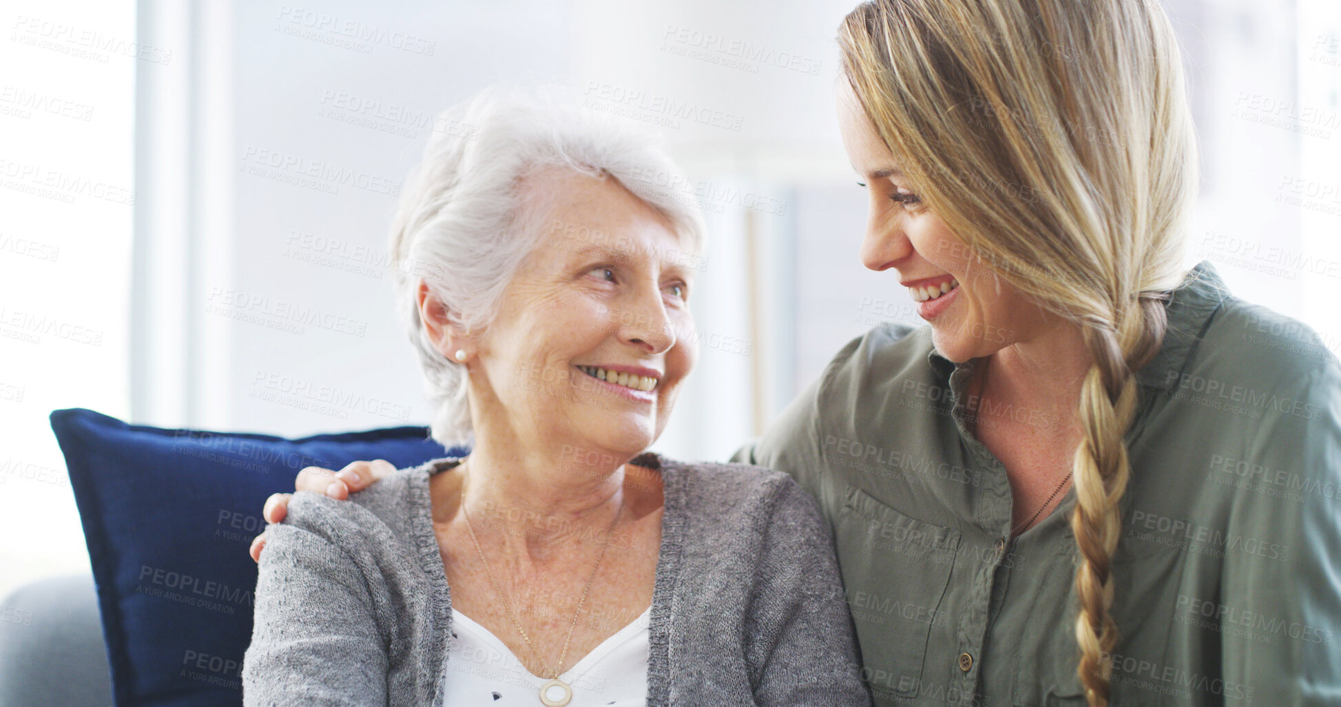 Buy stock photo Senior, woman and happy together with daughter on sofa for bonding, relationship and weekend visit in retirement. Love, people and smile in home with connection, support and relax for conversation