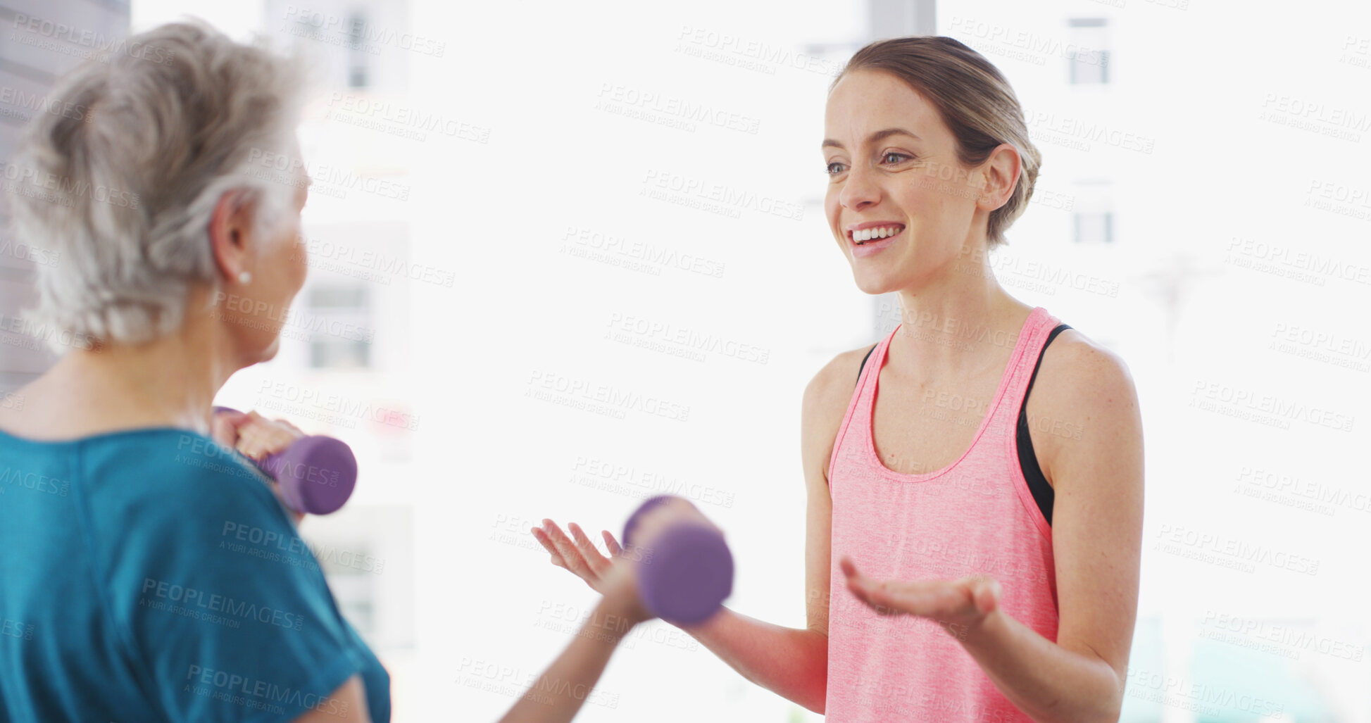 Buy stock photo Elderly woman, physiotherapist and weights in gym for fitness, instruction or arm injury recovery. Senior client, physiotherapy or dumbbells in practice for exercise, muscle development or joint care
