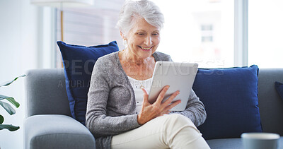 Buy stock photo House, tablet and senior woman with smile, typing and internet with connection in lounge. Pensioner, relax and elderly lady on couch, technology and digital app for texting, retirement and happiness
