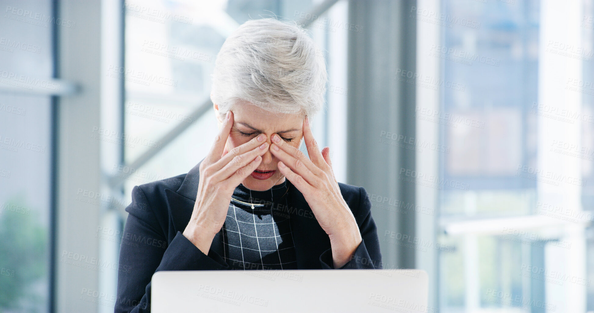 Buy stock photo Laptop, headache and mature woman in office, frustrated and overworked with payroll. Pain, employee and accountant with pc, fatigue and migraine with anxiety, stress or difficult audit with burnout