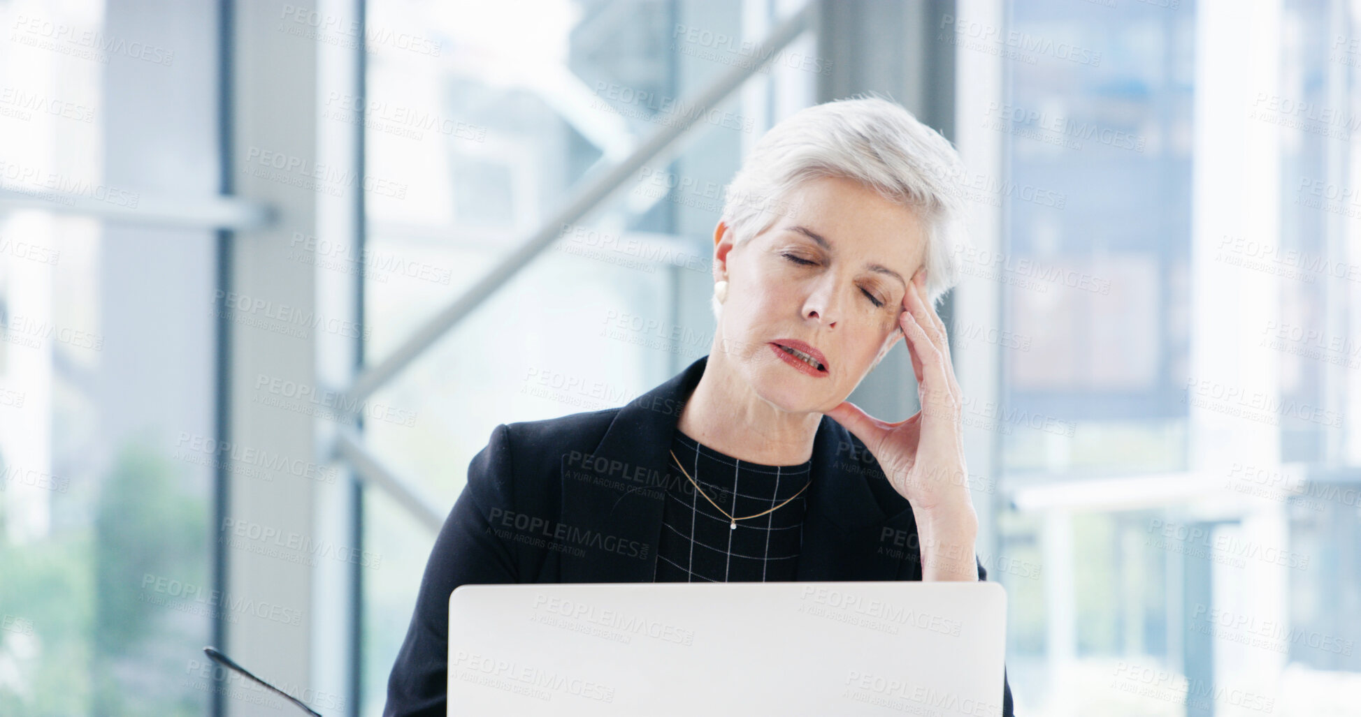 Buy stock photo Stress, laptop and mature woman with headache in office, difficult audit or overworked. Frustrated, employee or accountant with fatigue, burnout or migraine with anxiety, pain or tired with brain fog
