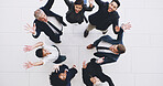 Happy, business people or meeting with celebration above for teamwork, success or motivation at office. Top view, group or excited employees with smile or hooray for completion, productivity or unity