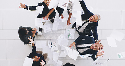 Buy stock photo Excited, business people and celebration above with documents in air for winning or team success at office. Top view, happy group or employees with smile for completion, done or finished at workplace